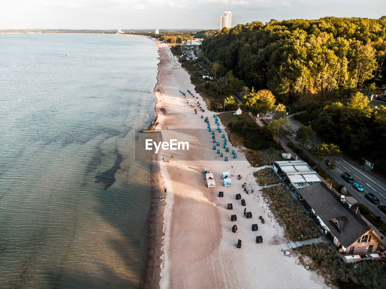 Aerial drone view over the east sea in germany with beach huts.