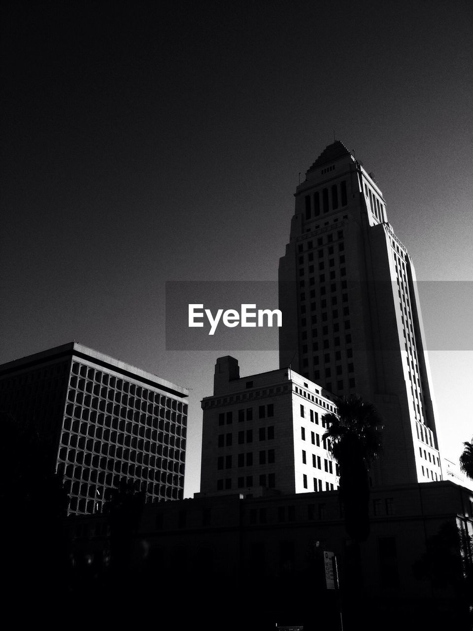 Low angle view of tall buildings against clear sky