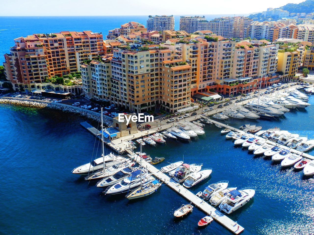 HIGH ANGLE VIEW OF CITY BUILDINGS AT WATERFRONT