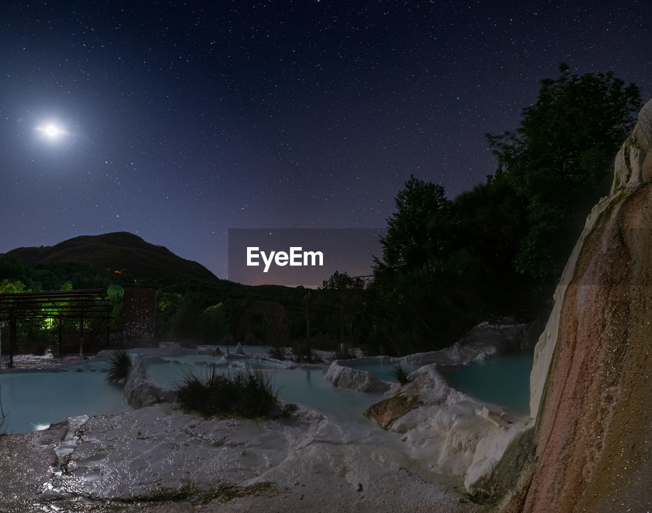 scenic view of mountains against sky at night