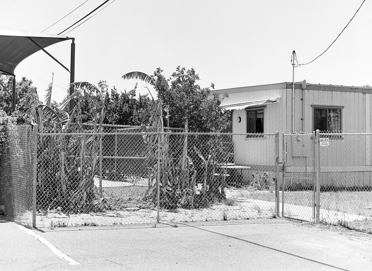 VIEW OF ROAD ALONG BUILDINGS