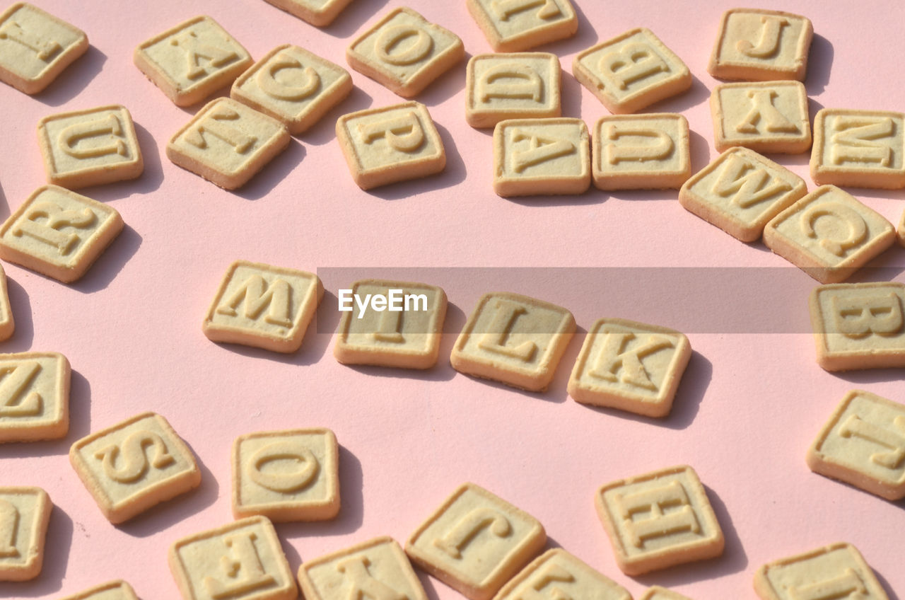 High angle view of biscuits with milk text on table