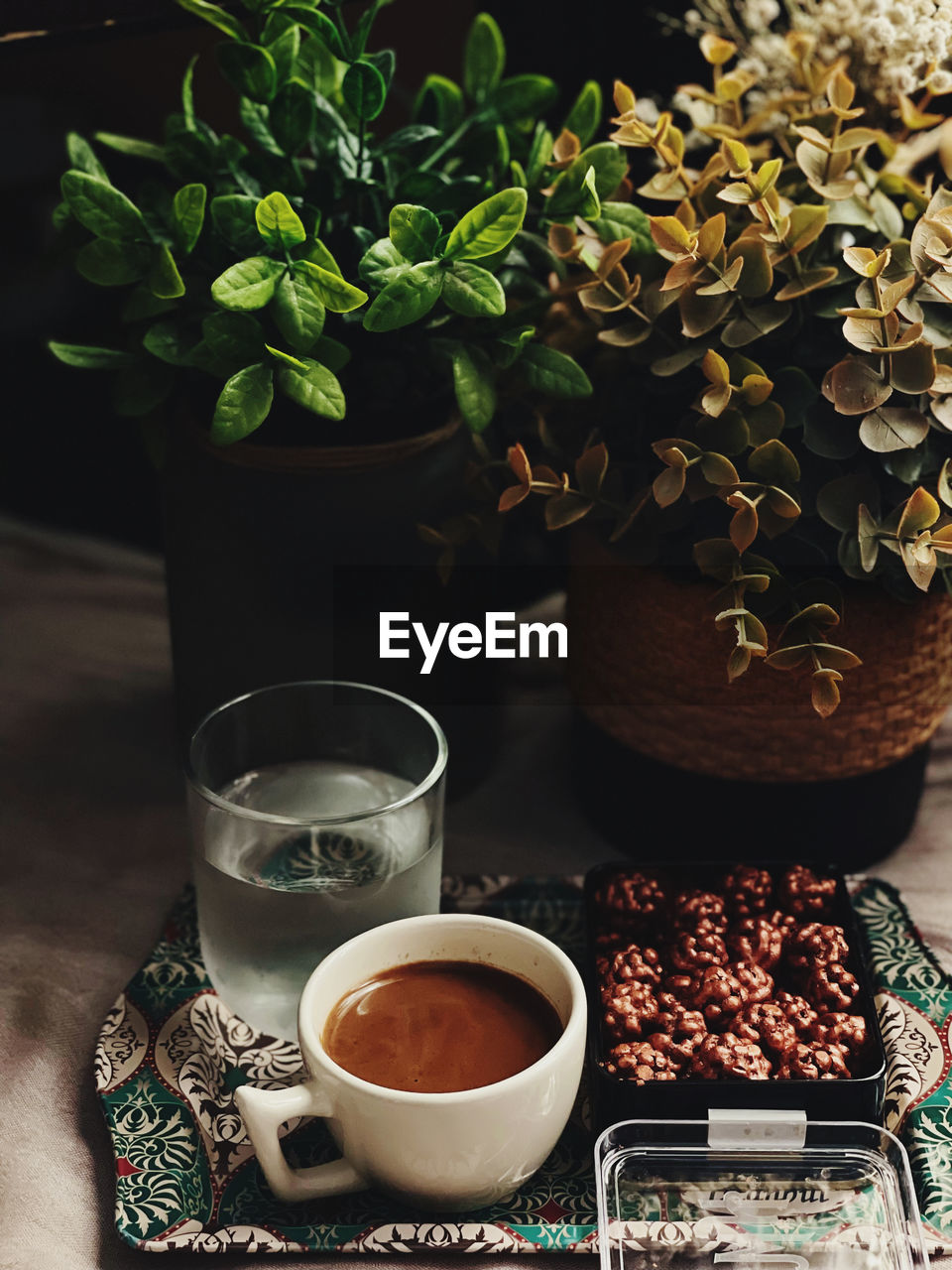 TEA CUP AND COFFEE ON TABLE