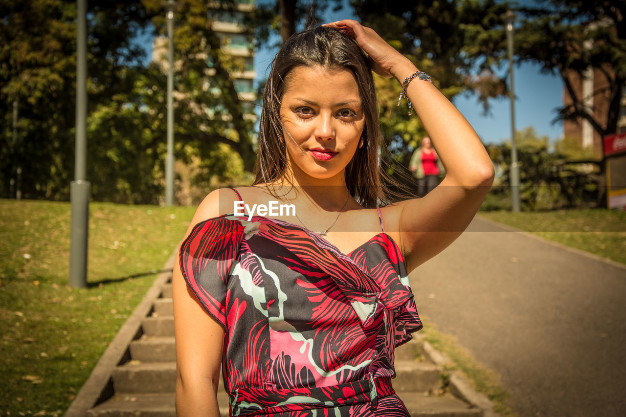 Portrait of beautiful woman standing outdoors