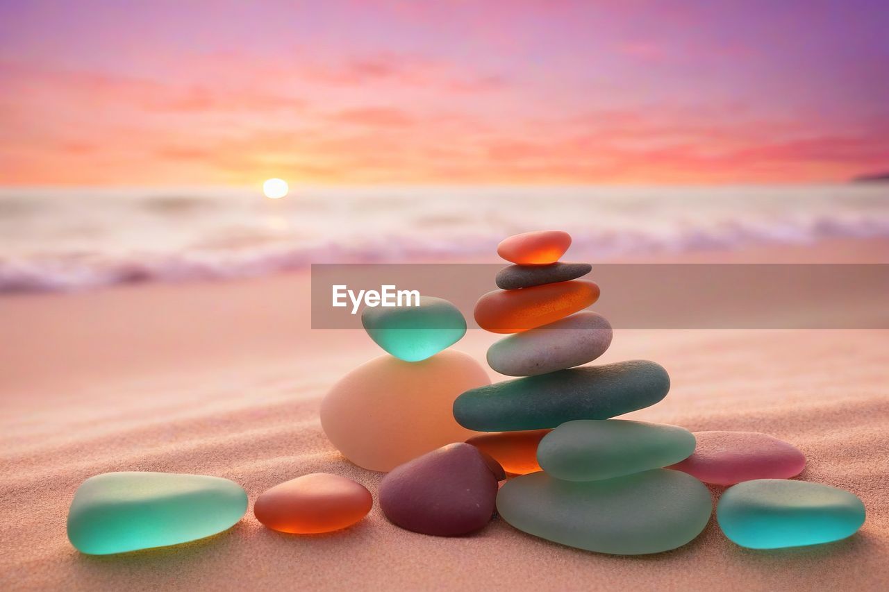 multi colored, land, medicine, sunset, nature, sky, pill, pharmaceutical drug, no people, dose, healthcare and medicine, beach, orange color, sand, large group of objects, drug, water, focus on foreground, environment, zen-like, sea, close-up, tranquility, group of objects