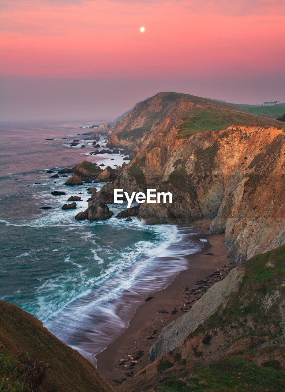 Scenic view of sea against sky during sunset