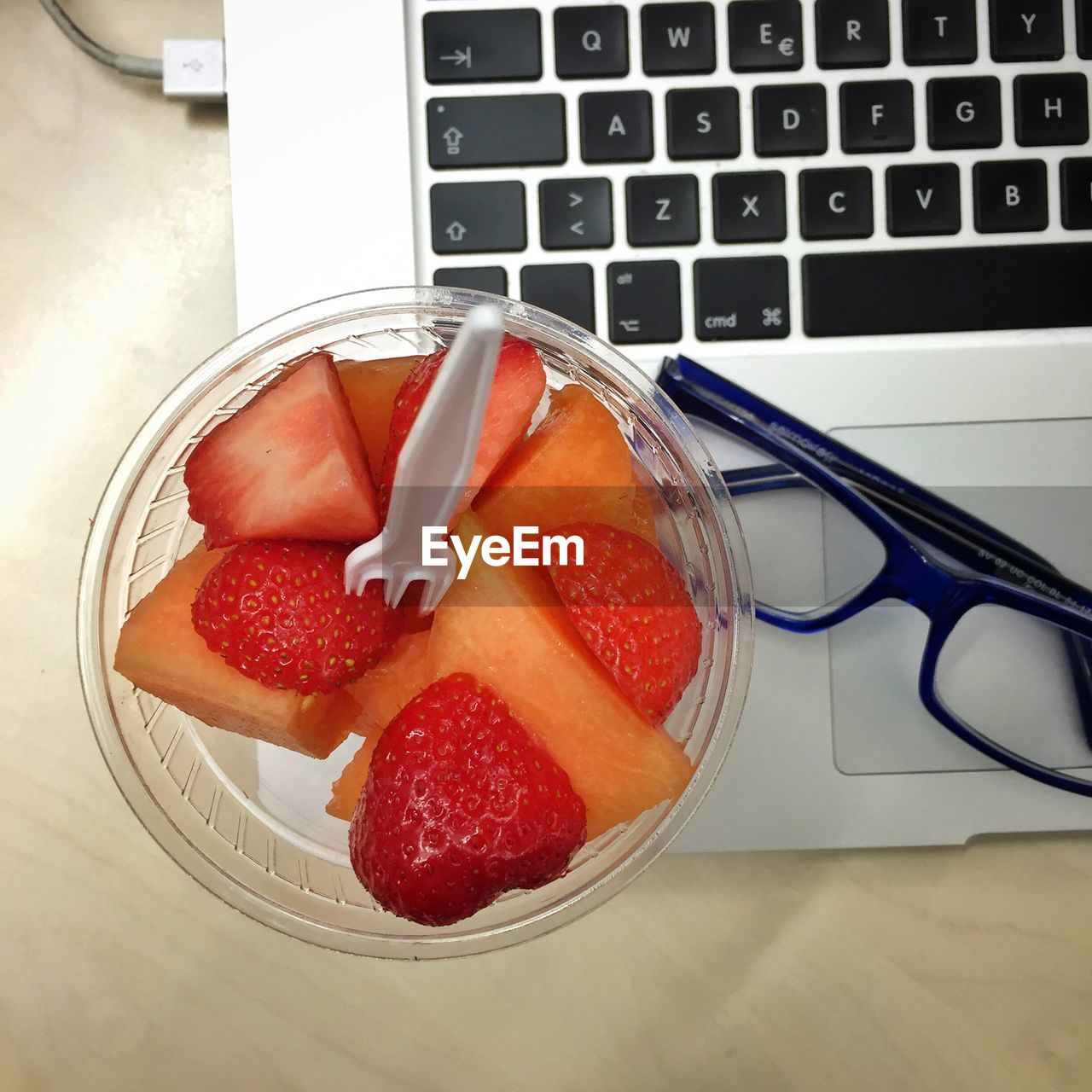 High angle view of strawberries on table