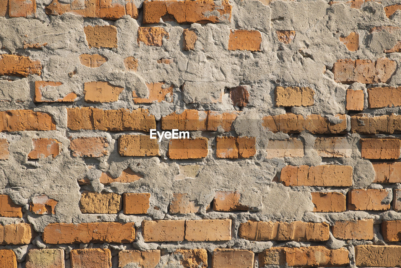 full frame shot of weathered brick wall