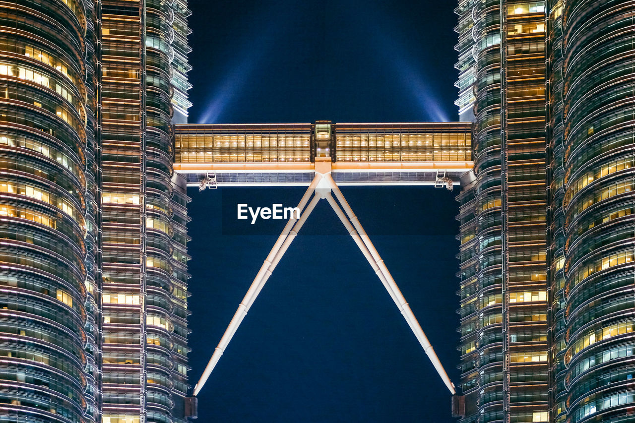 Illuminated petronas towers at night