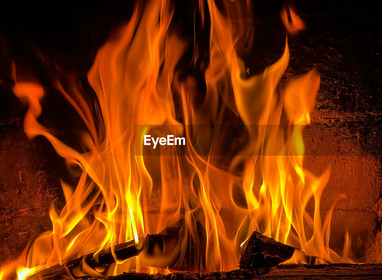 burning, fire, flame, heat, nature, fireplace, orange color, no people, wood, campfire, sign, communication, yellow, bonfire, motion, warning sign, log, glowing, night, close-up, power generation, red, font, outdoors