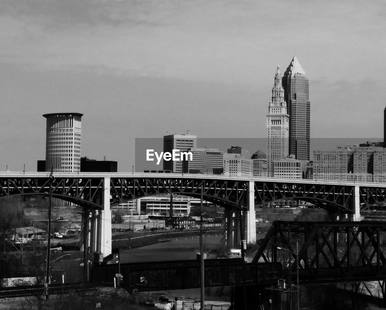 Modern buildings and bridge against sky in city