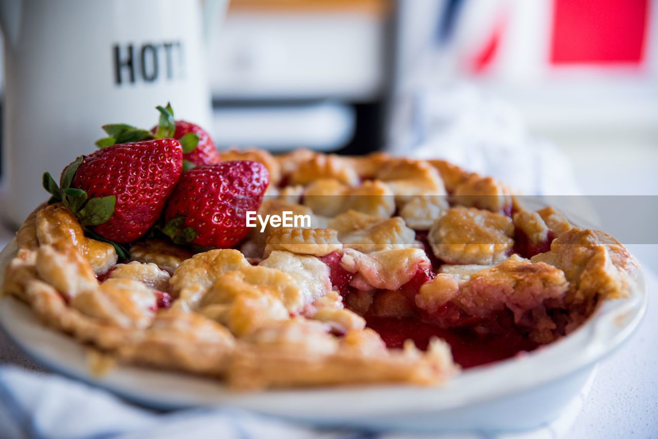 High angle view of strawberry pie on table