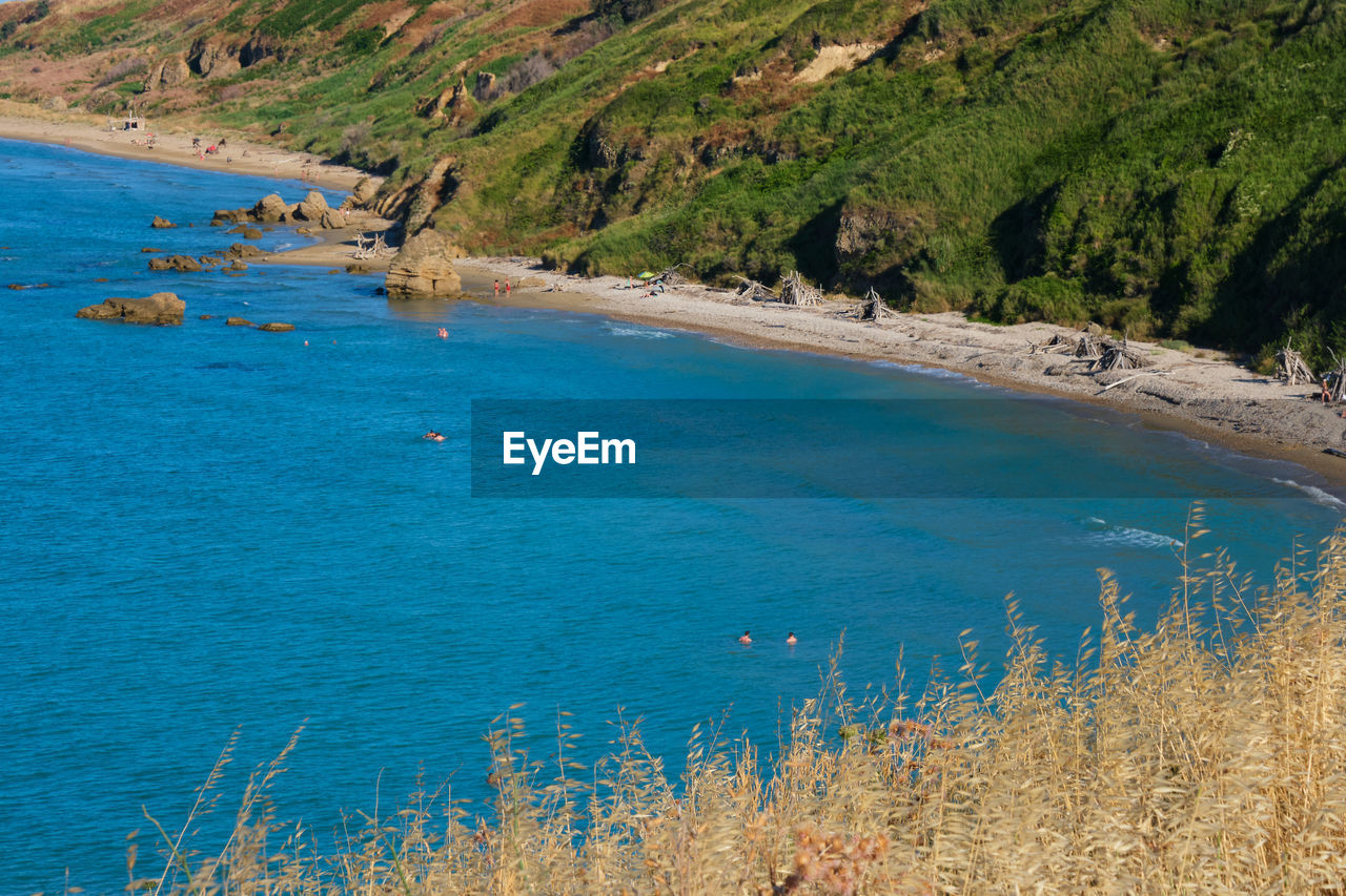 Beach with people bathing in the vast abruzzo sea