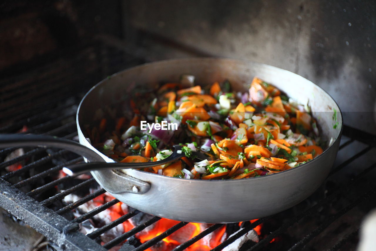 Fresh vegetables in pan on barbecue grill
