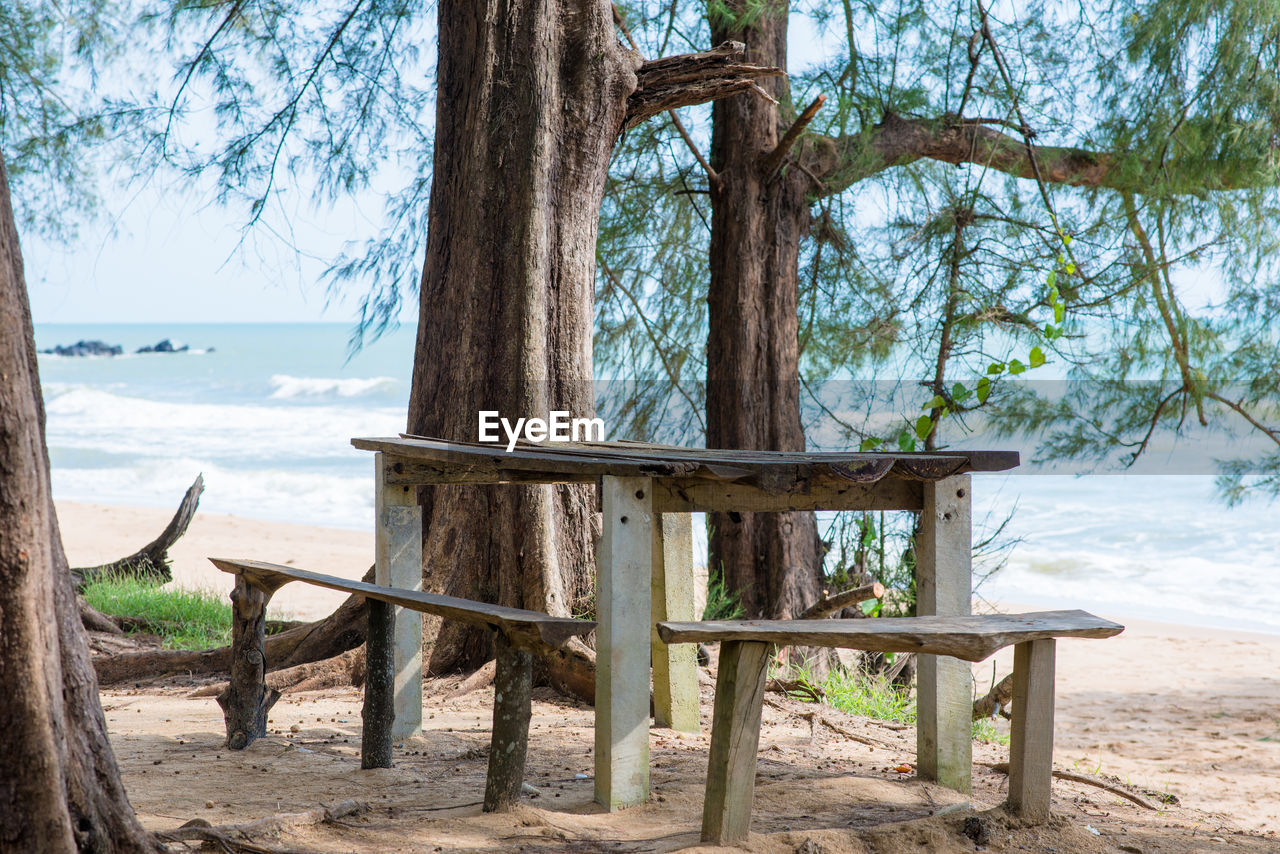 CHAIR ON SHORE AGAINST SEA
