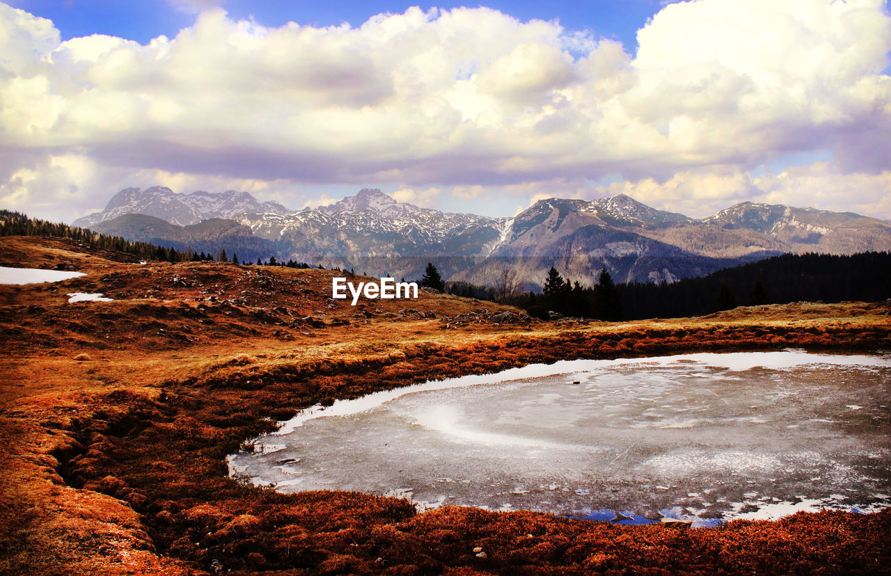 Scenic view of mountains against sky during sunset