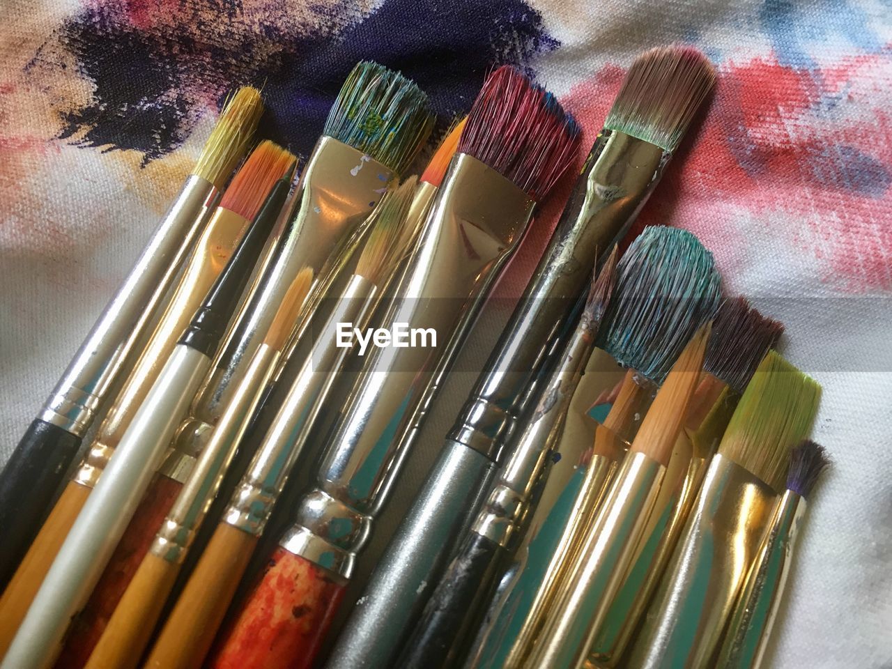 Close-up of paintbrushes on textile