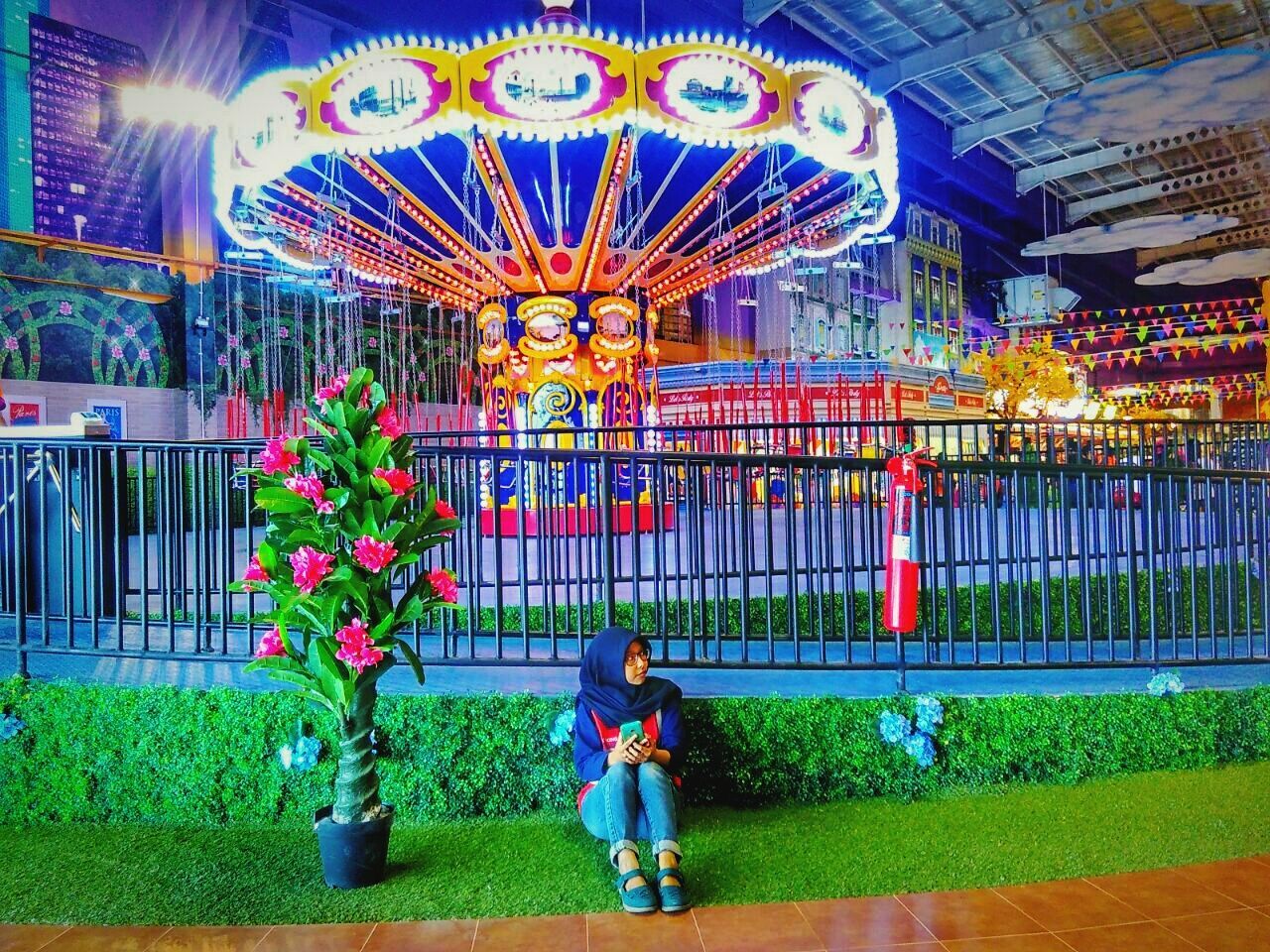 FULL LENGTH OF SMILING BOY ON AMUSEMENT PARK