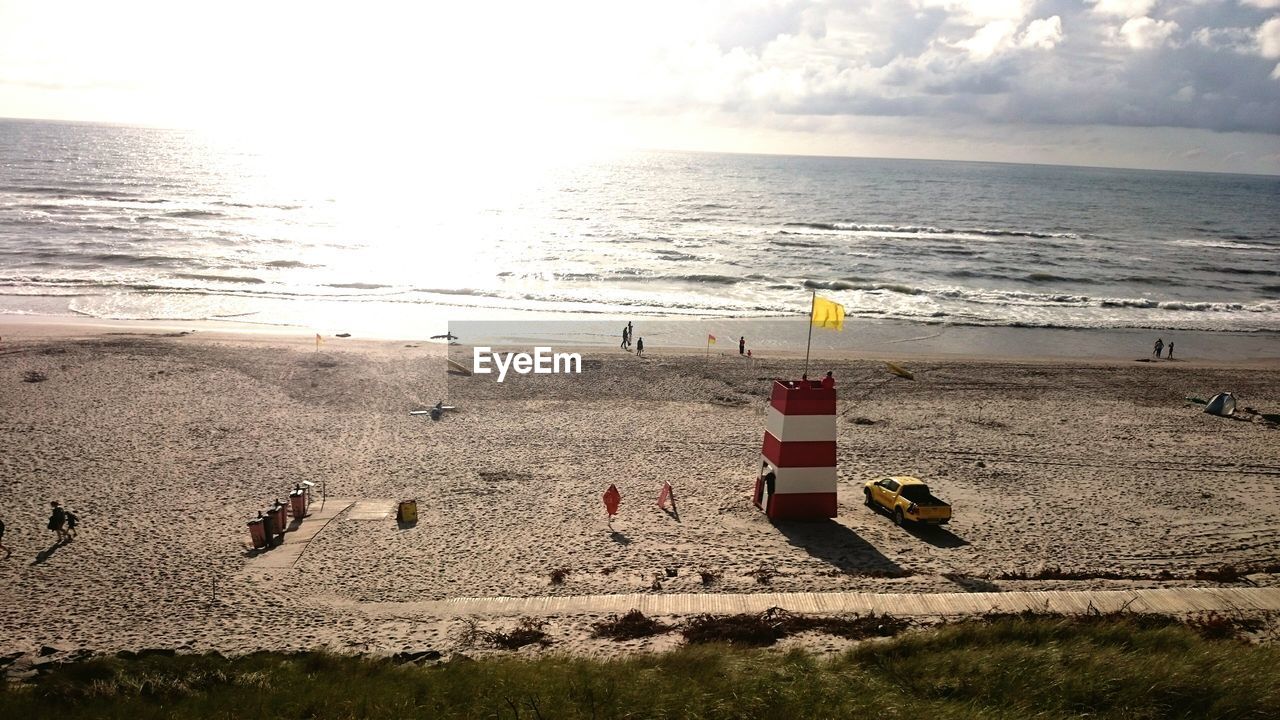 Scenic view of beach against sky during sunset