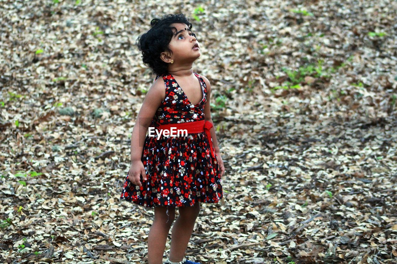 Girl standing on field