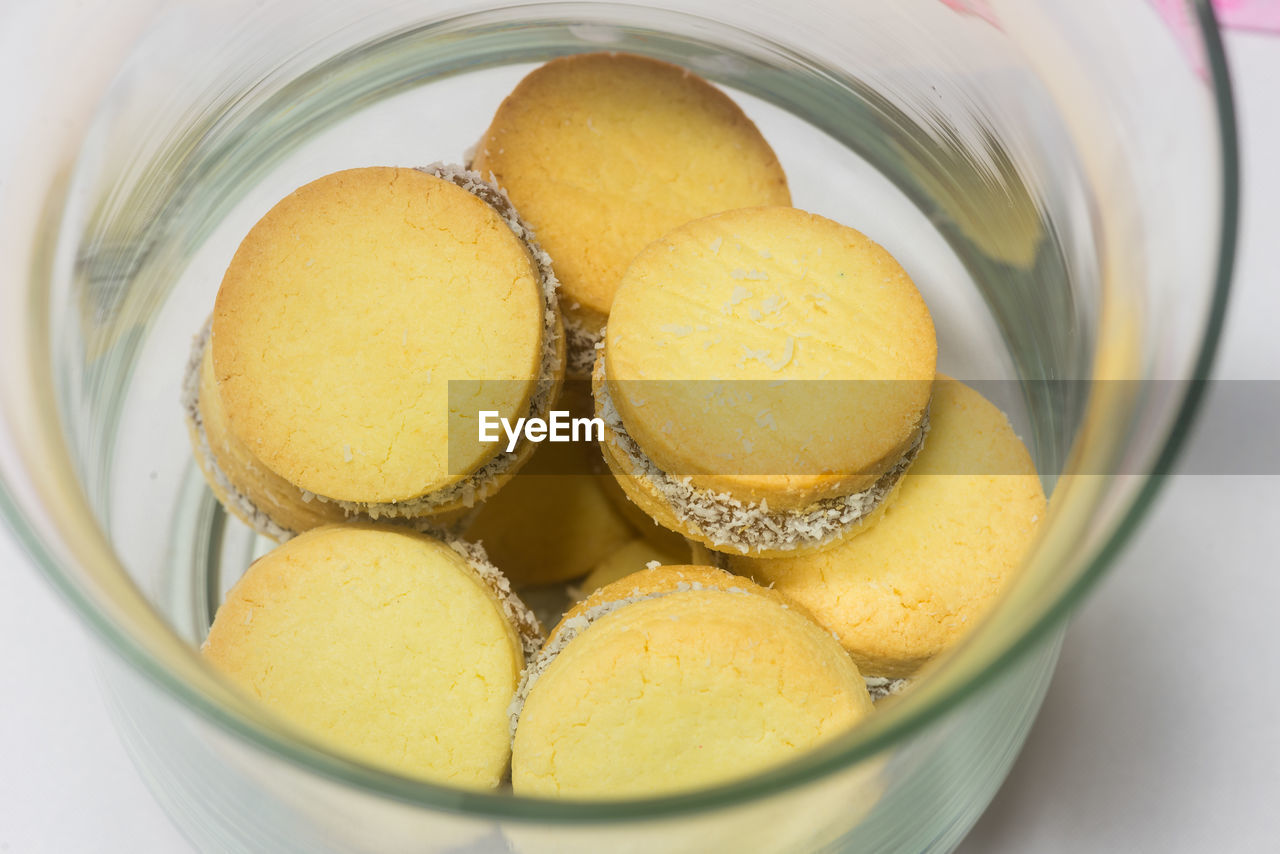 food and drink, food, sweet food, dessert, sweet, freshness, citrus, indoors, bowl, container, produce, no people, close-up, still life, lemon, yellow, healthy eating, temptation, household equipment