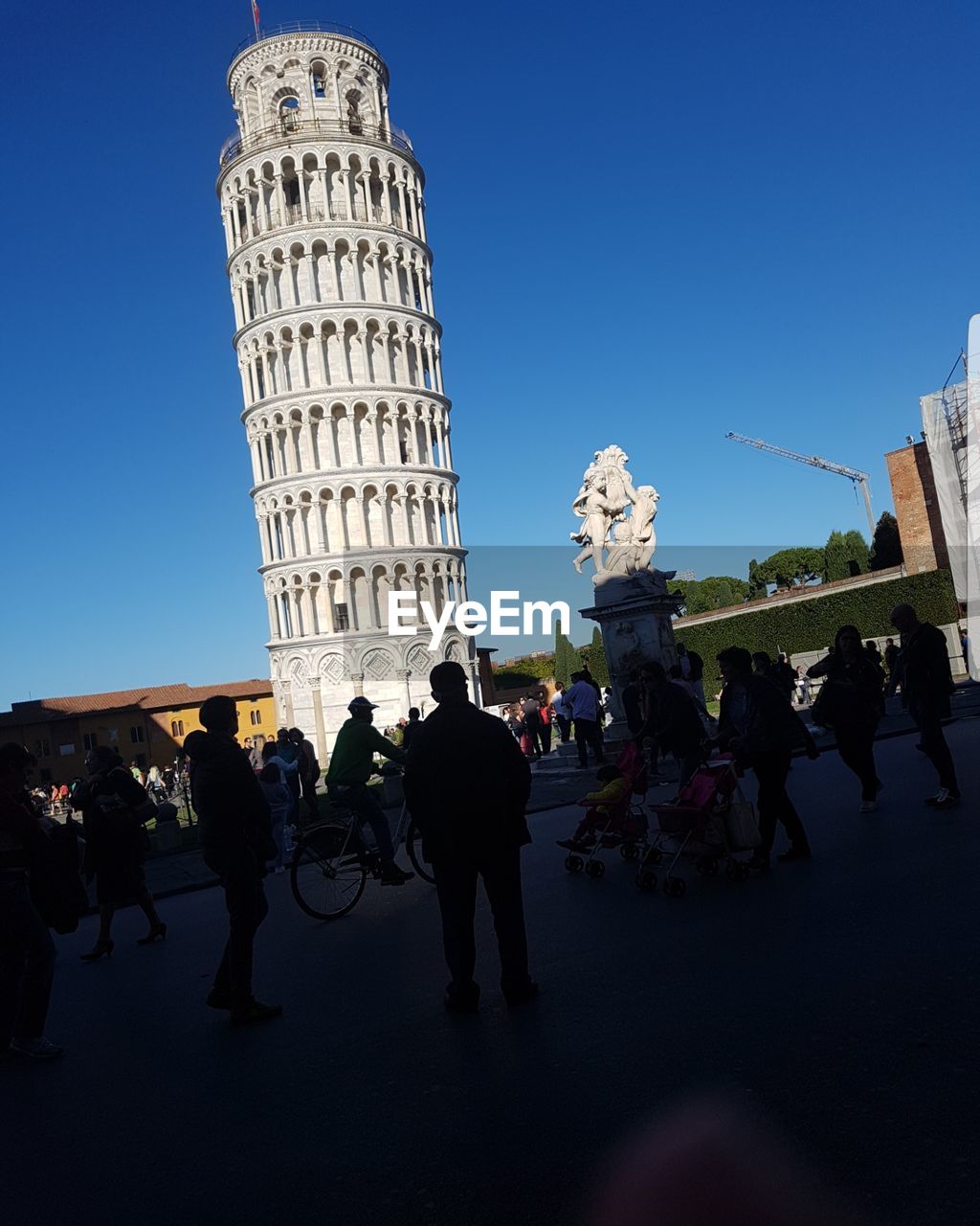 LOW ANGLE VIEW OF PEOPLE WALKING IN CITY