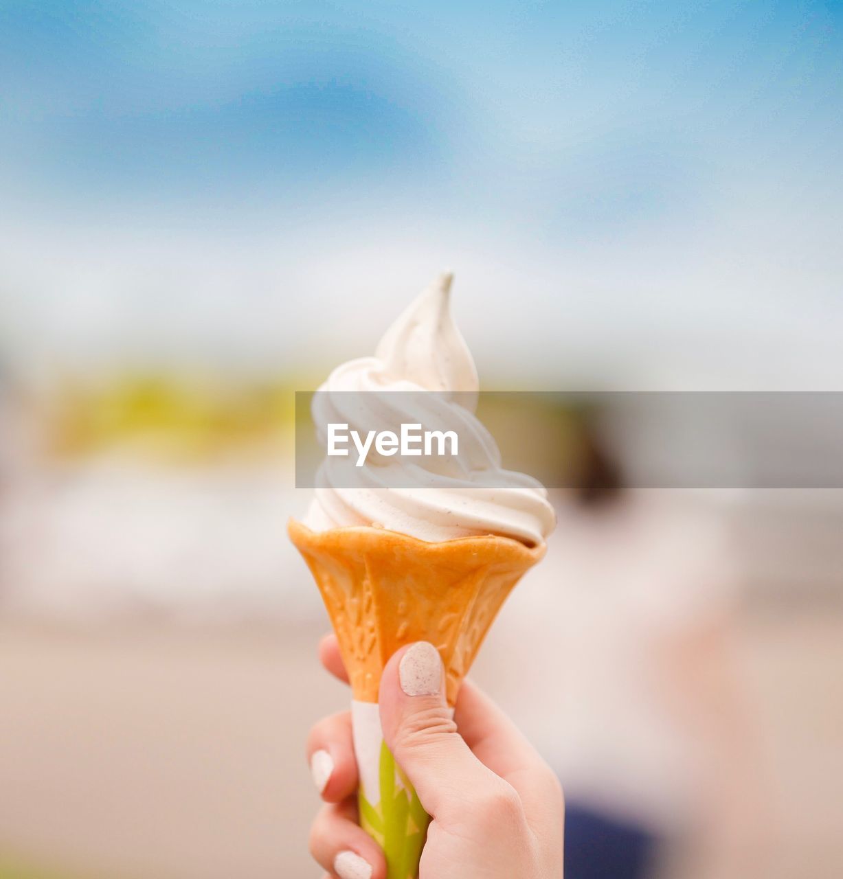 Cropped hand of person holding ice cream cone