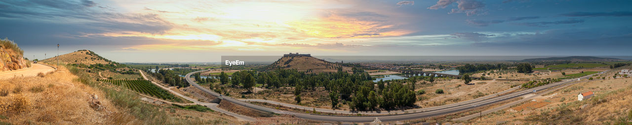 Panoramic view of landscape against cloudy sky