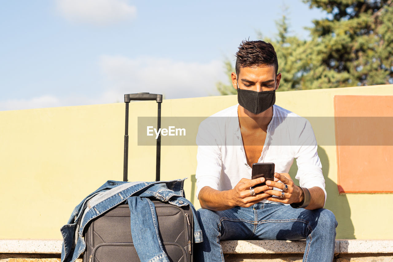 Young man using mobile phone