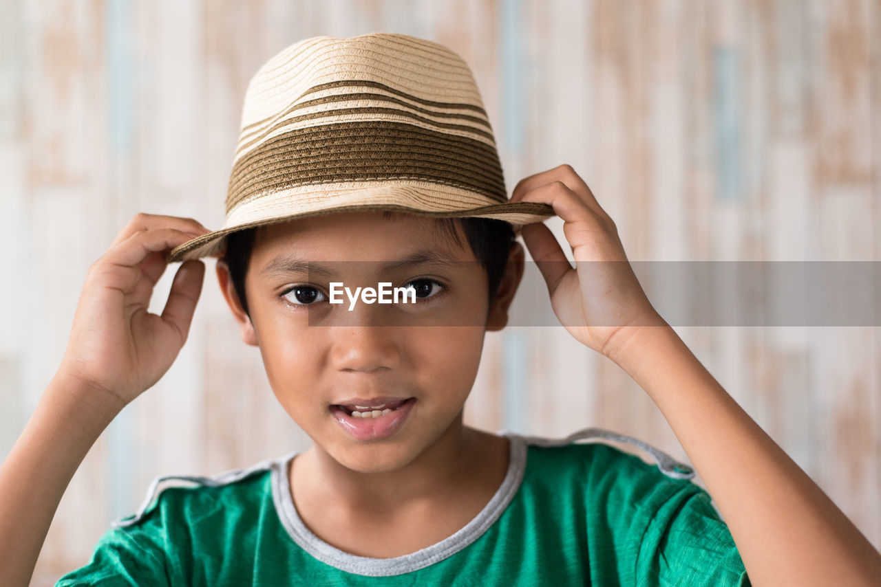 Portrait of cute boy wearing hat