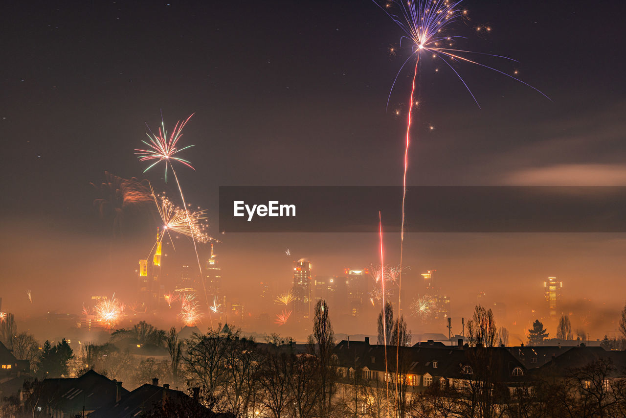 FIREWORK DISPLAY AGAINST SKY