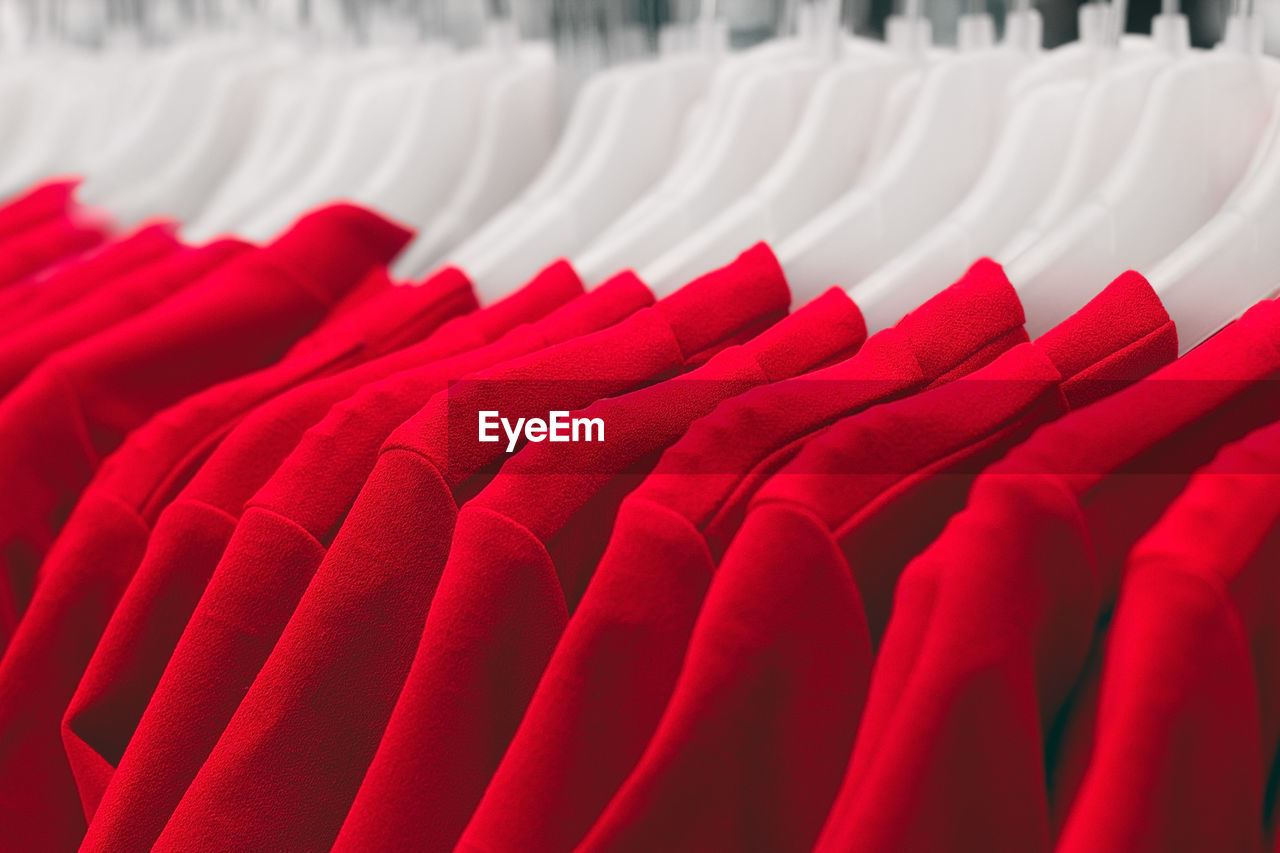 Close-up of red clothes hanging on chair