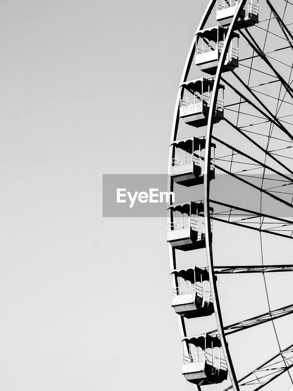 Low angle view of ferris wheel against clear sky