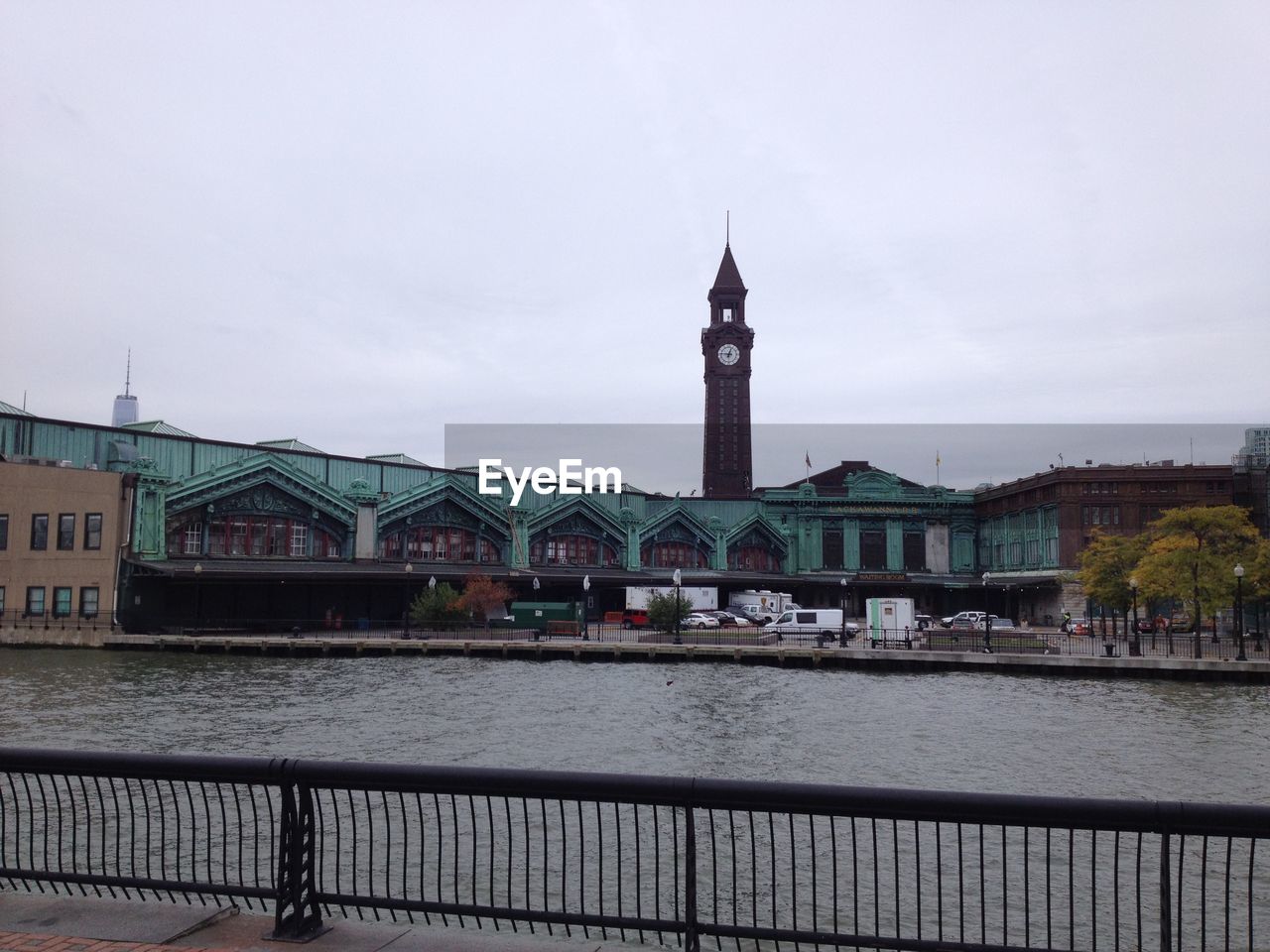 VIEW OF RIVER WITH BUILDINGS IN BACKGROUND