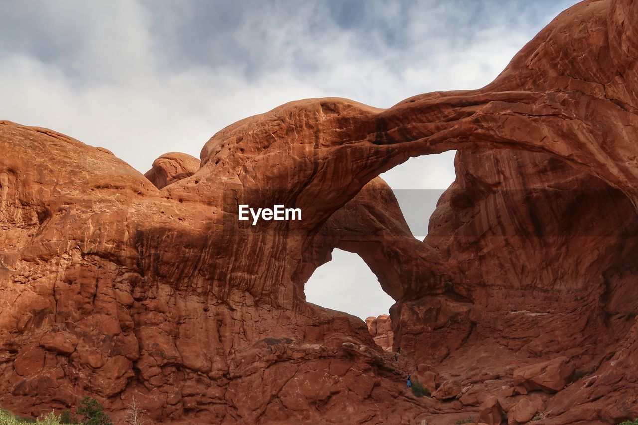 LOW ANGLE VIEW OF ROCK FORMATION IN SKY