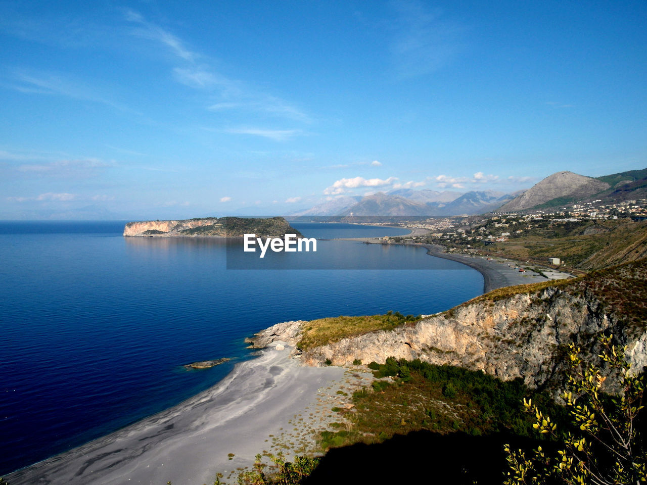 Scenic view of sea against cloudy sky