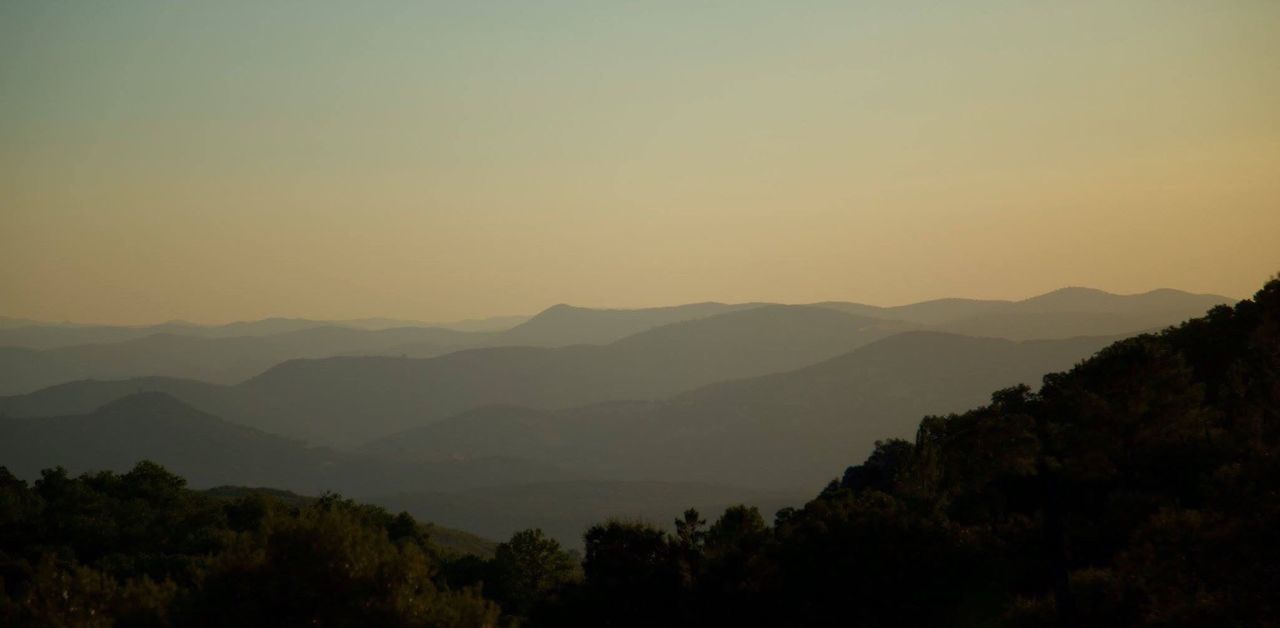 Scenic view of mountains during foggy weather