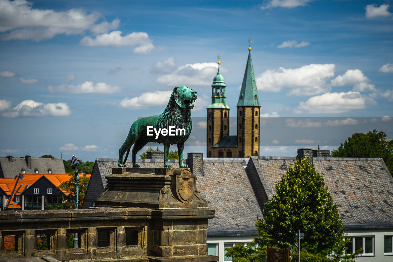 Statue of historic building against cloudy sky, blick über die dächer von goslar von der kaiserpfalz