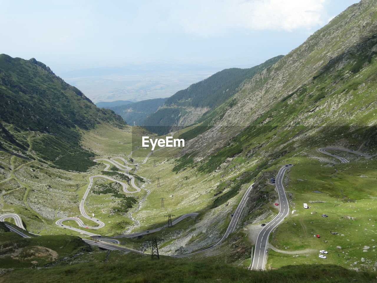 High angle view of winding roads on mountain against sky