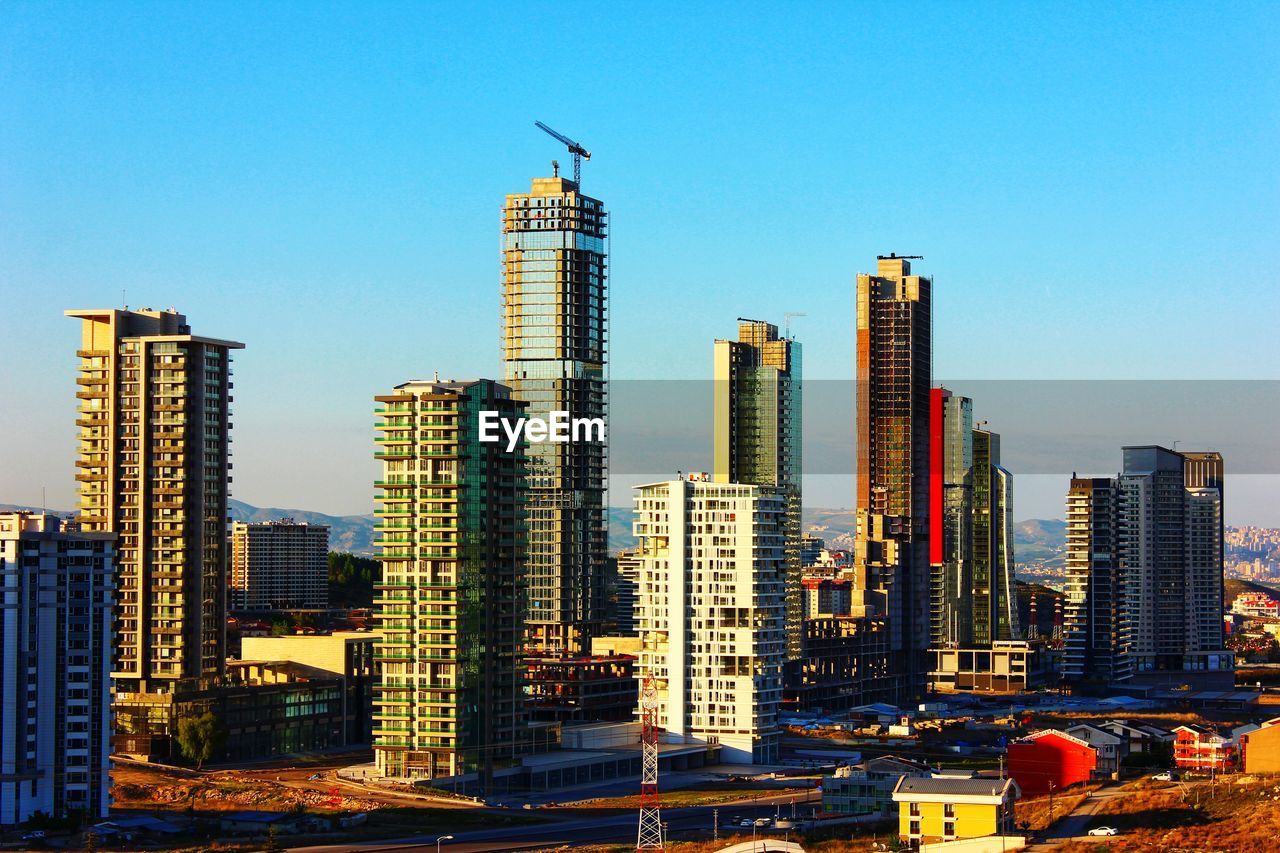 MODERN BUILDINGS AGAINST BLUE SKY