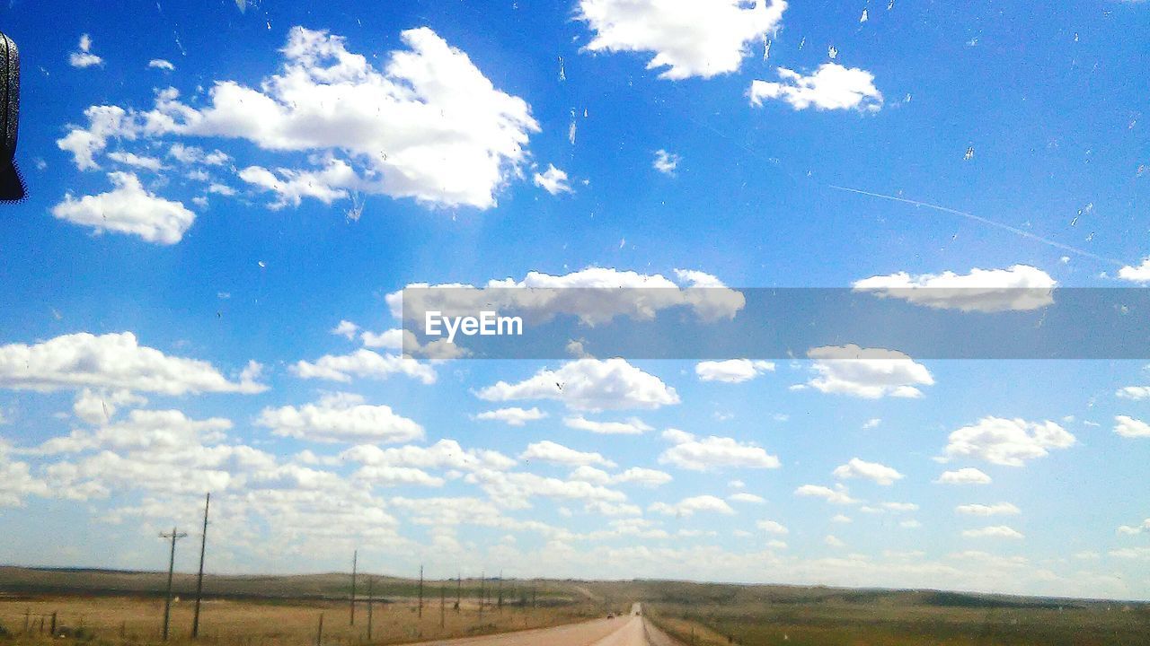 SCENIC VIEW OF LANDSCAPE AGAINST CLOUDY SKY