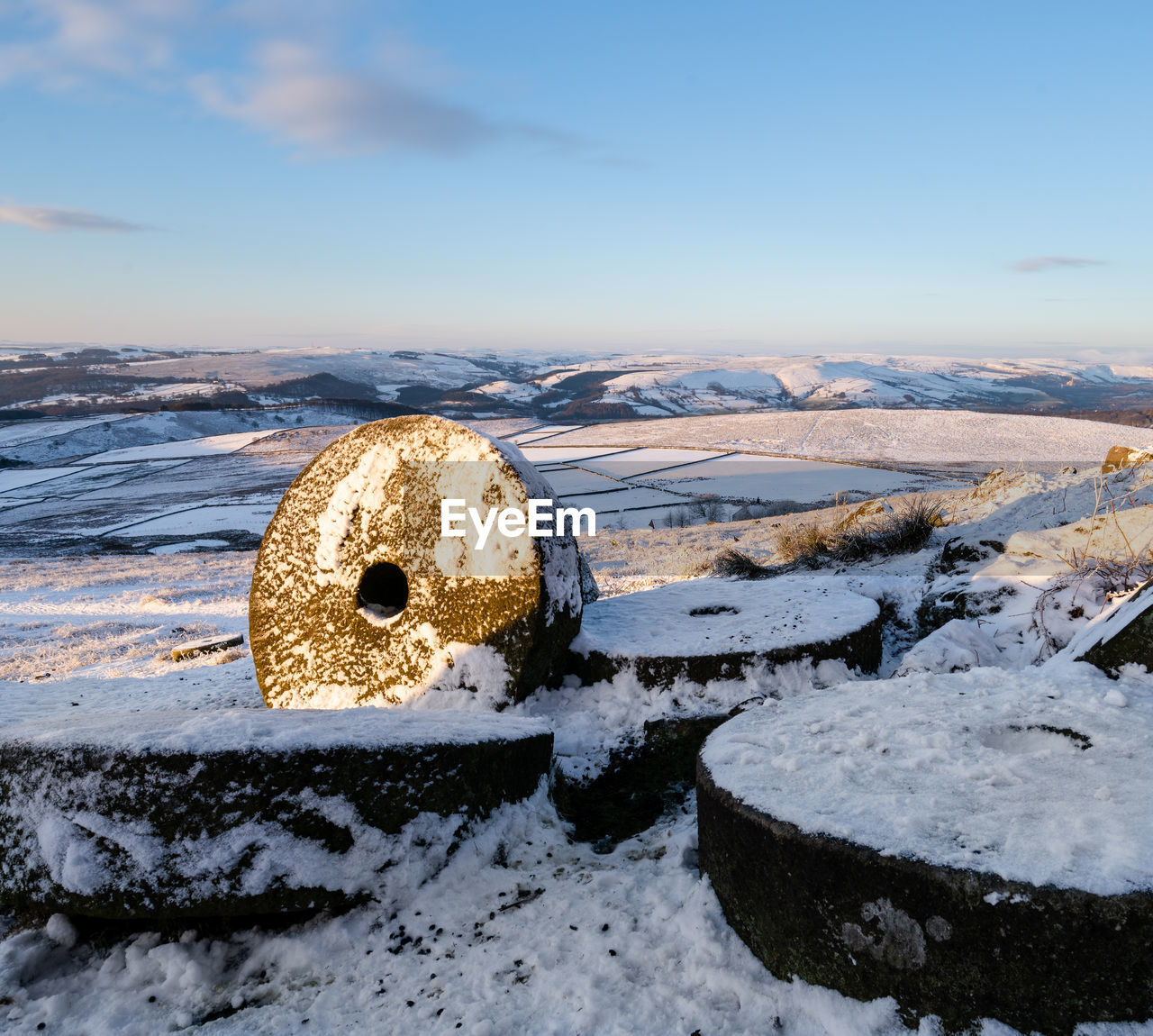 Snow covered land against sky