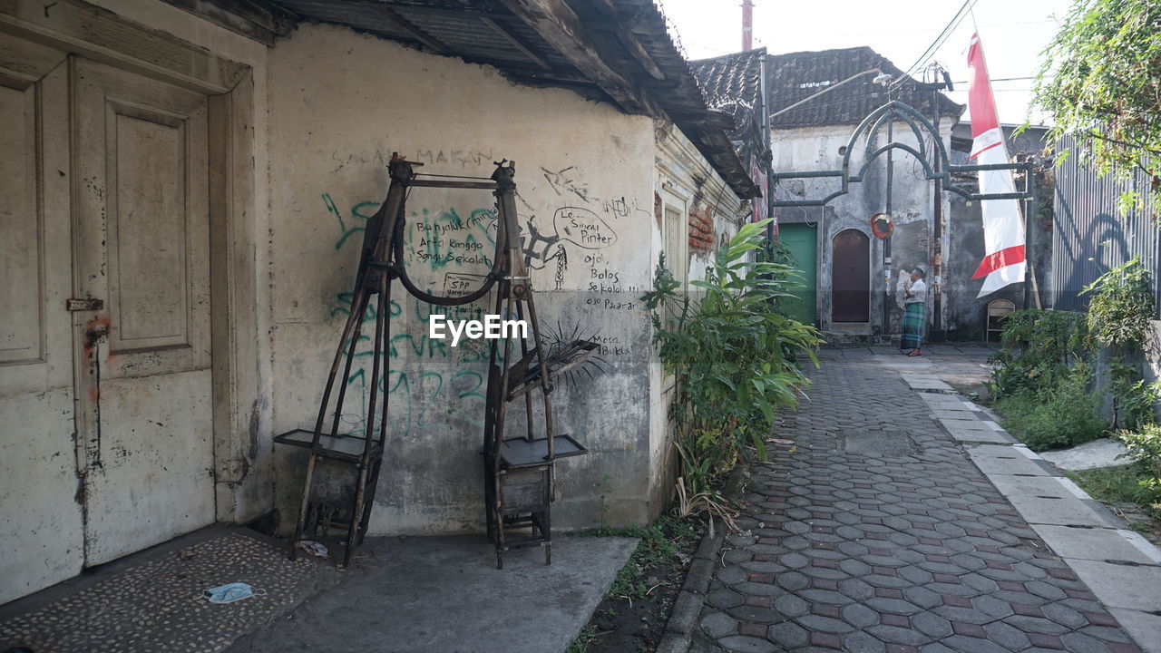 FOOTPATH AMIDST HOUSES AND BUILDINGS