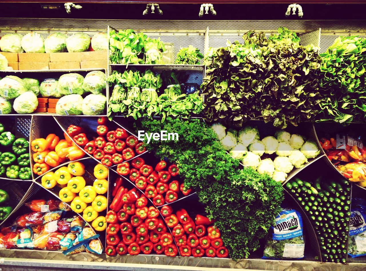 Vegetables arranged for sale at market stall