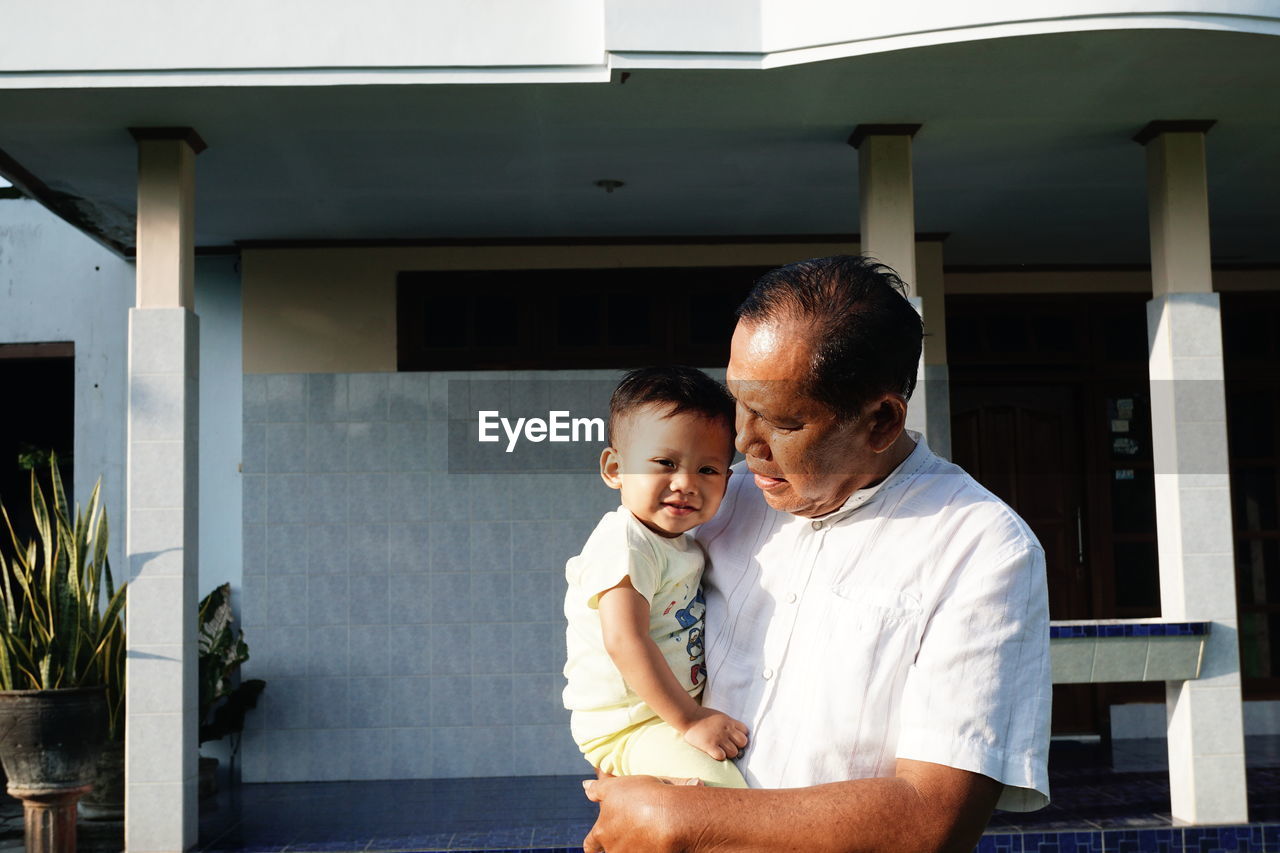 Grand father and son at home