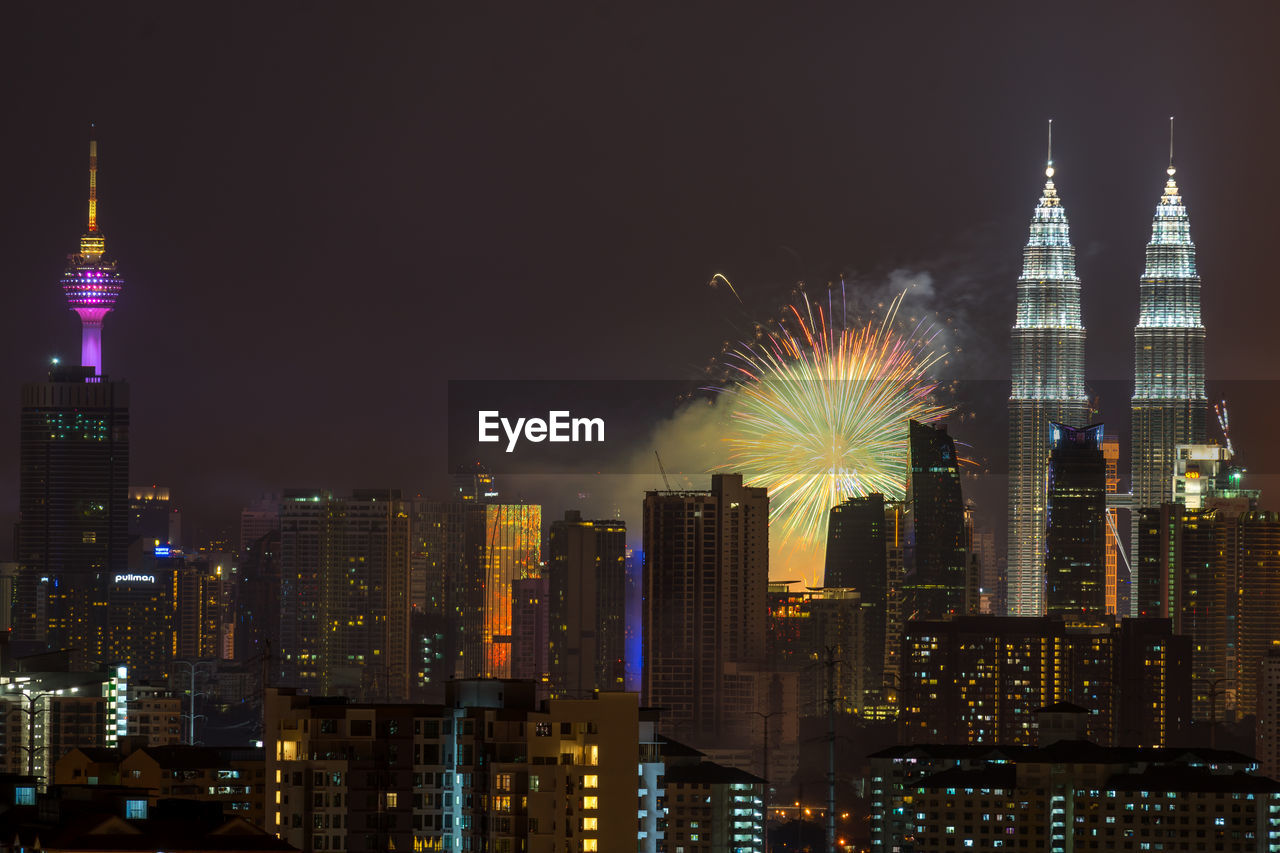 High angle view of firework display over cityscape