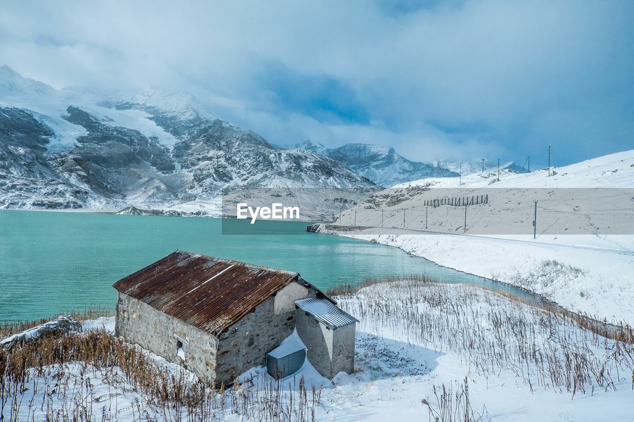 High angle view of lake como by snowcapped mountain during winter