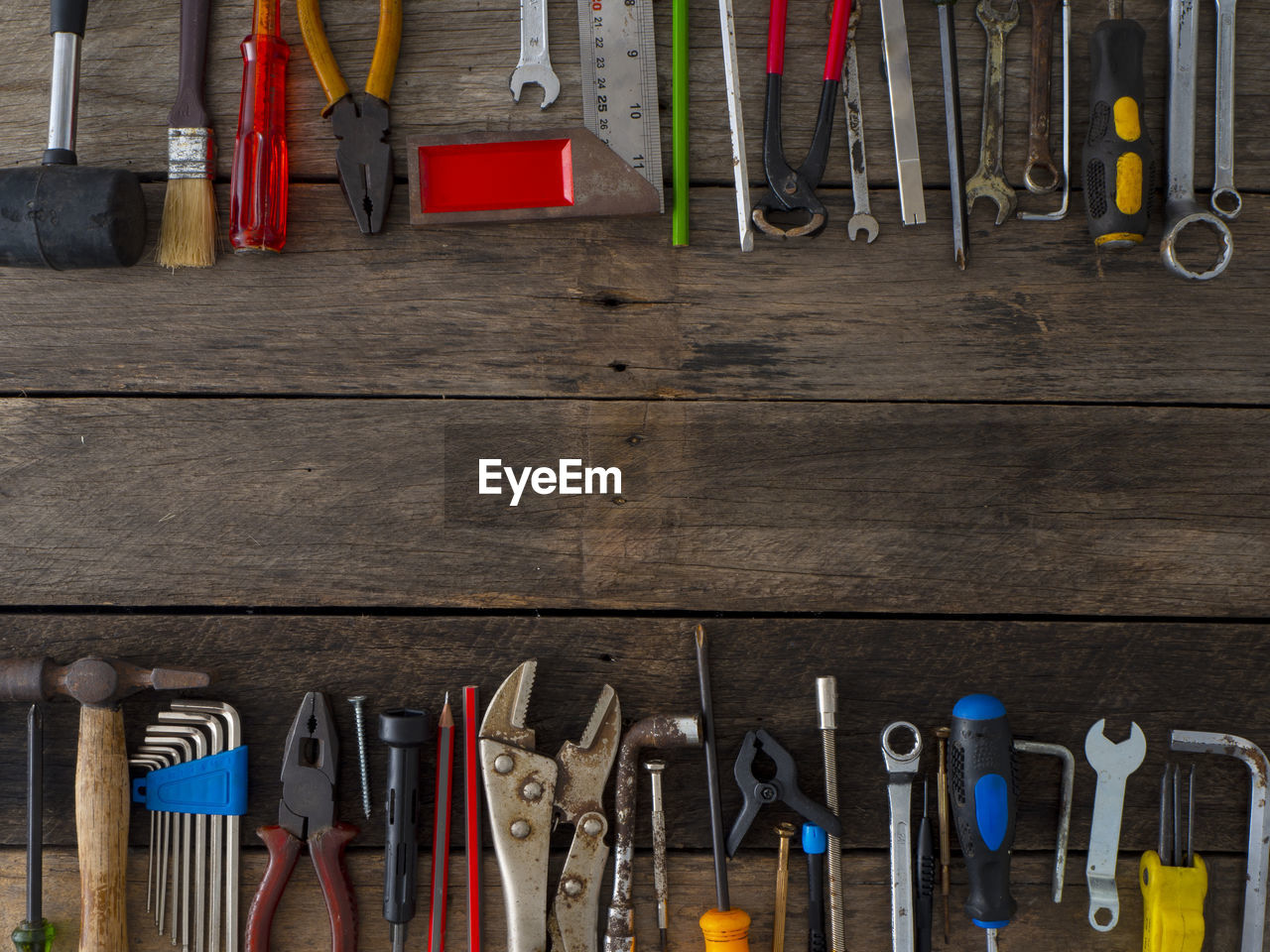 Directly above shot of work tools on wooden table