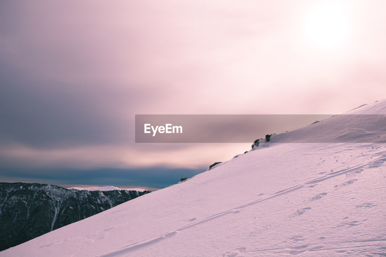 Snow covered mountain against sky