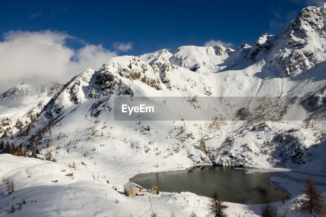 scenic view of snow covered mountains against sky